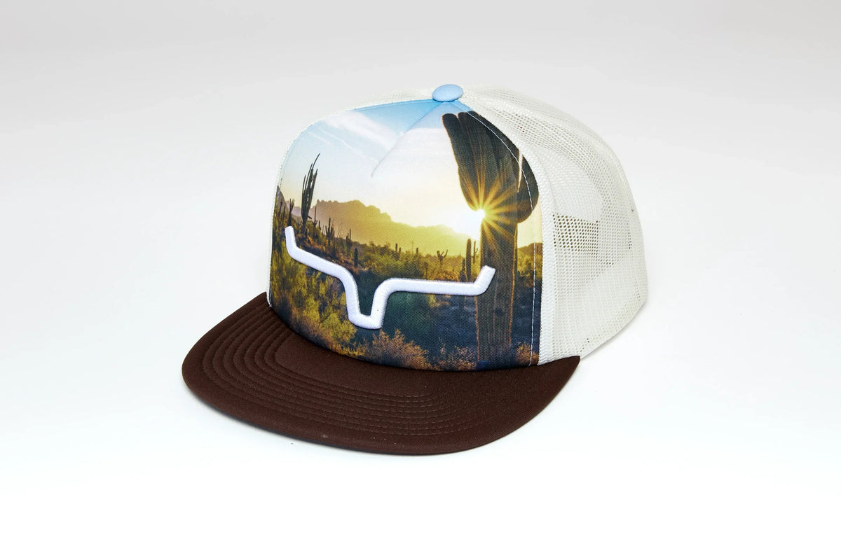 Kimes Ranch Crestview hat with a Brown brim, white mesh back, and a desert sunset graphic with a white Kimes Ranch logo