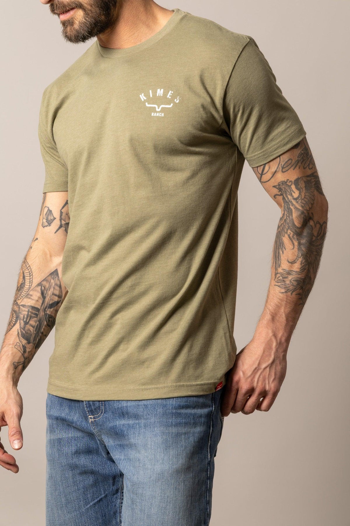 Kimes Ranch Cut Through shirt in Light Olive, side view, with a crew neck and short sleeves