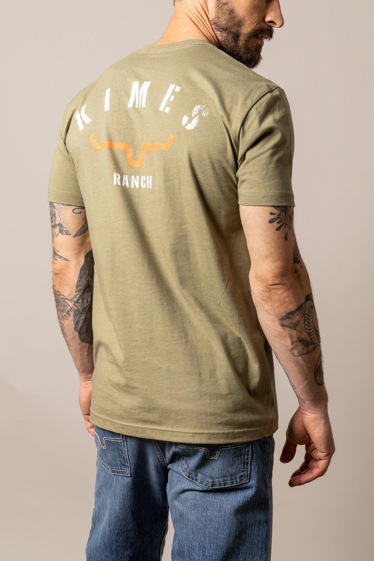 Kimes Ranch Cut Through shirt in Light Olive, back view, with the Kimes Ranch logo on the back