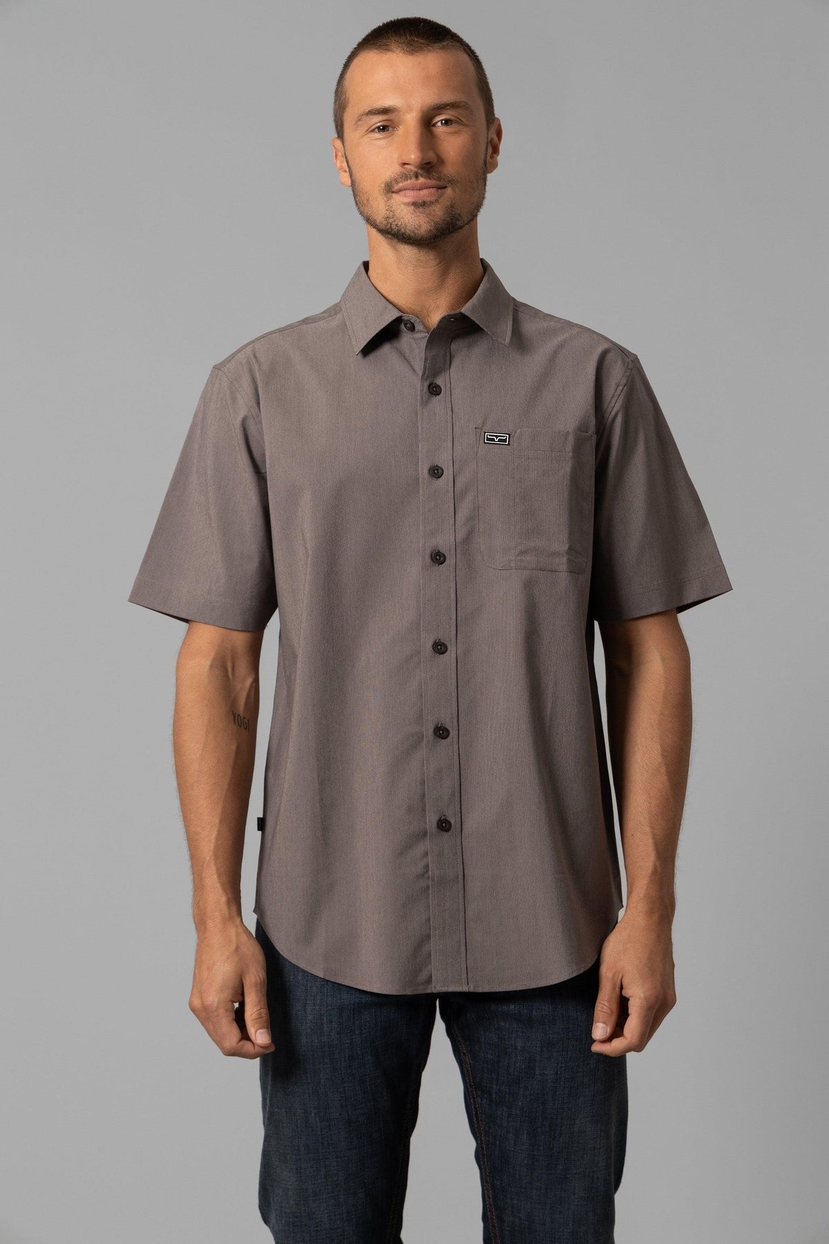 Kimes Ranch Linville Short Sleeve Dress Shirt in Brown with a chest pocket and logo patch