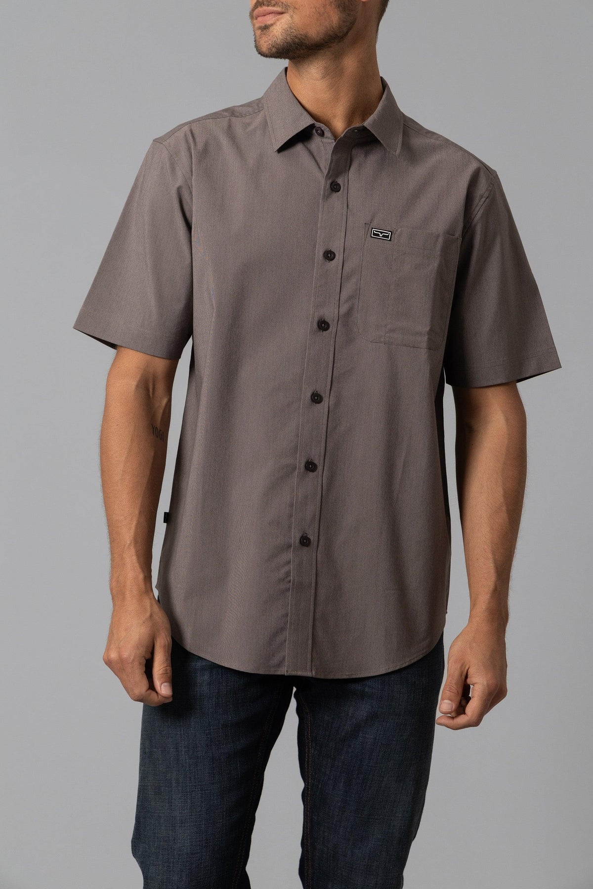 Kimes Ranch Linville Short Sleeve Dress Shirt in Brown with a chest pocket and logo patch
