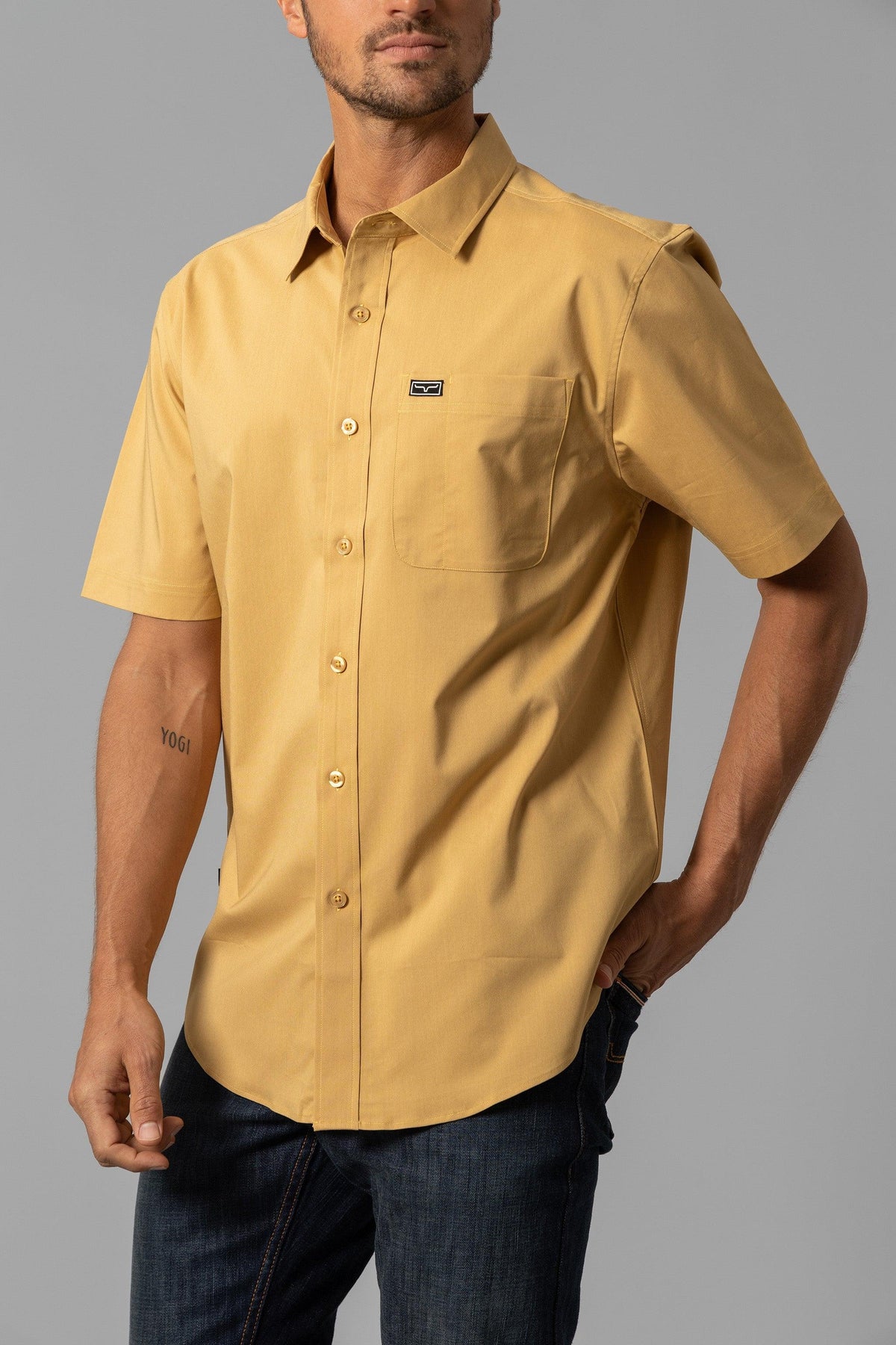 Kimes Ranch Linville Short Sleeve Dress Shirt in Gold with a chest pocket and logo patch