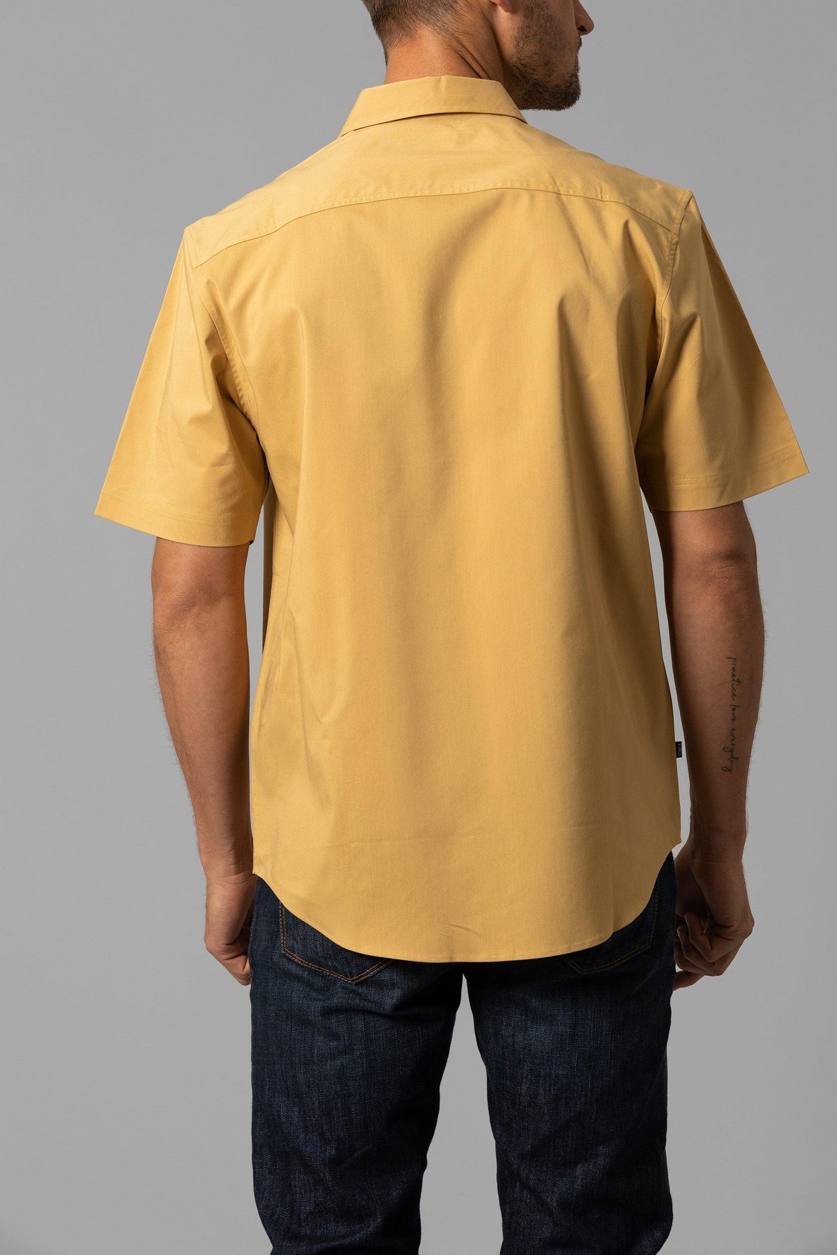 Kimes Ranch Linville Short Sleeve Dress Shirt in Gold, back view, with a back yoke and short sleeves