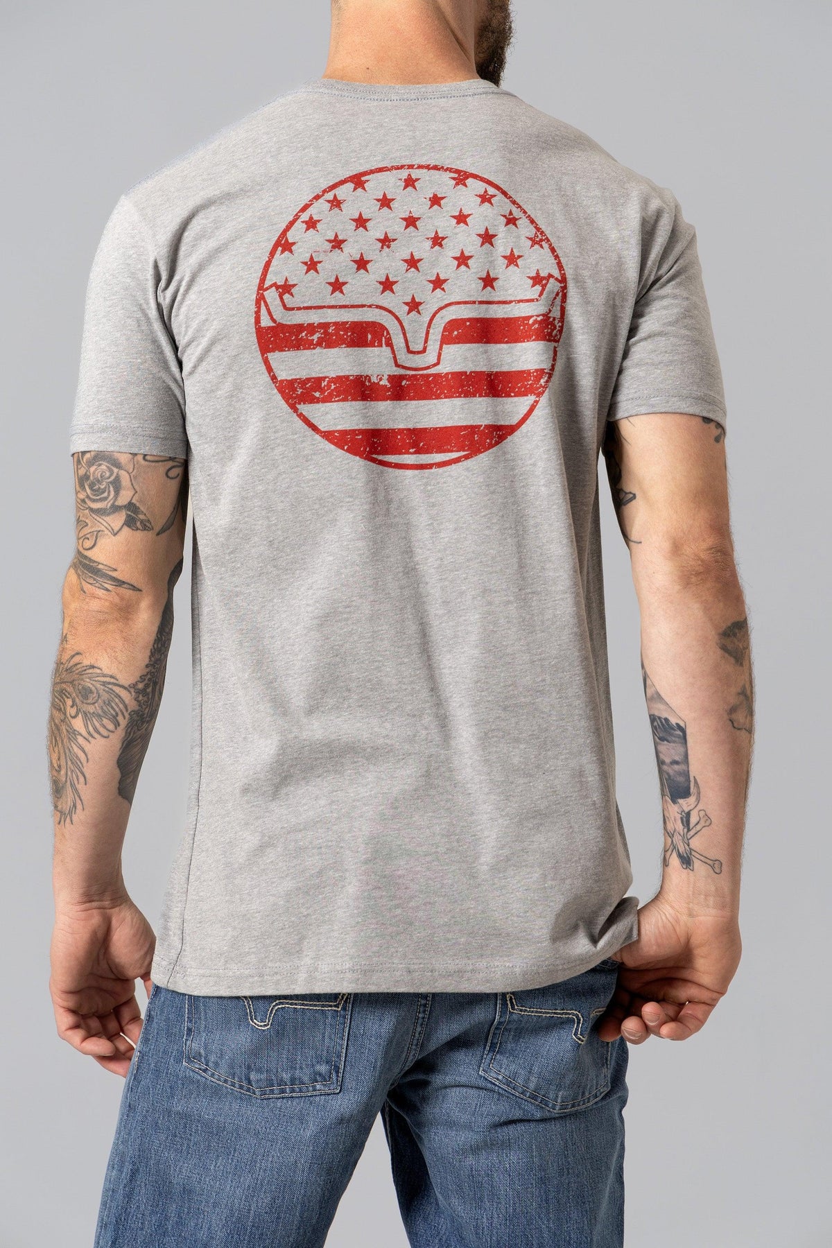 Kimes Ranch American Bullseye Shirt in Dark Grey Heather, back view, with a red distressed circular graphic on the back