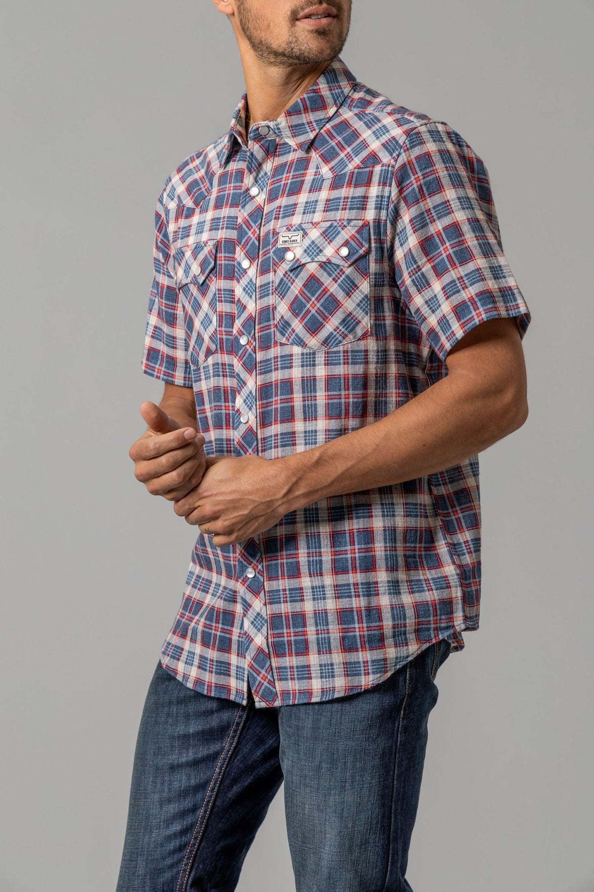 Kimes Ranch Danford short sleeve button-up dress shirt in Blue plaid with two chest pockets and white buttons