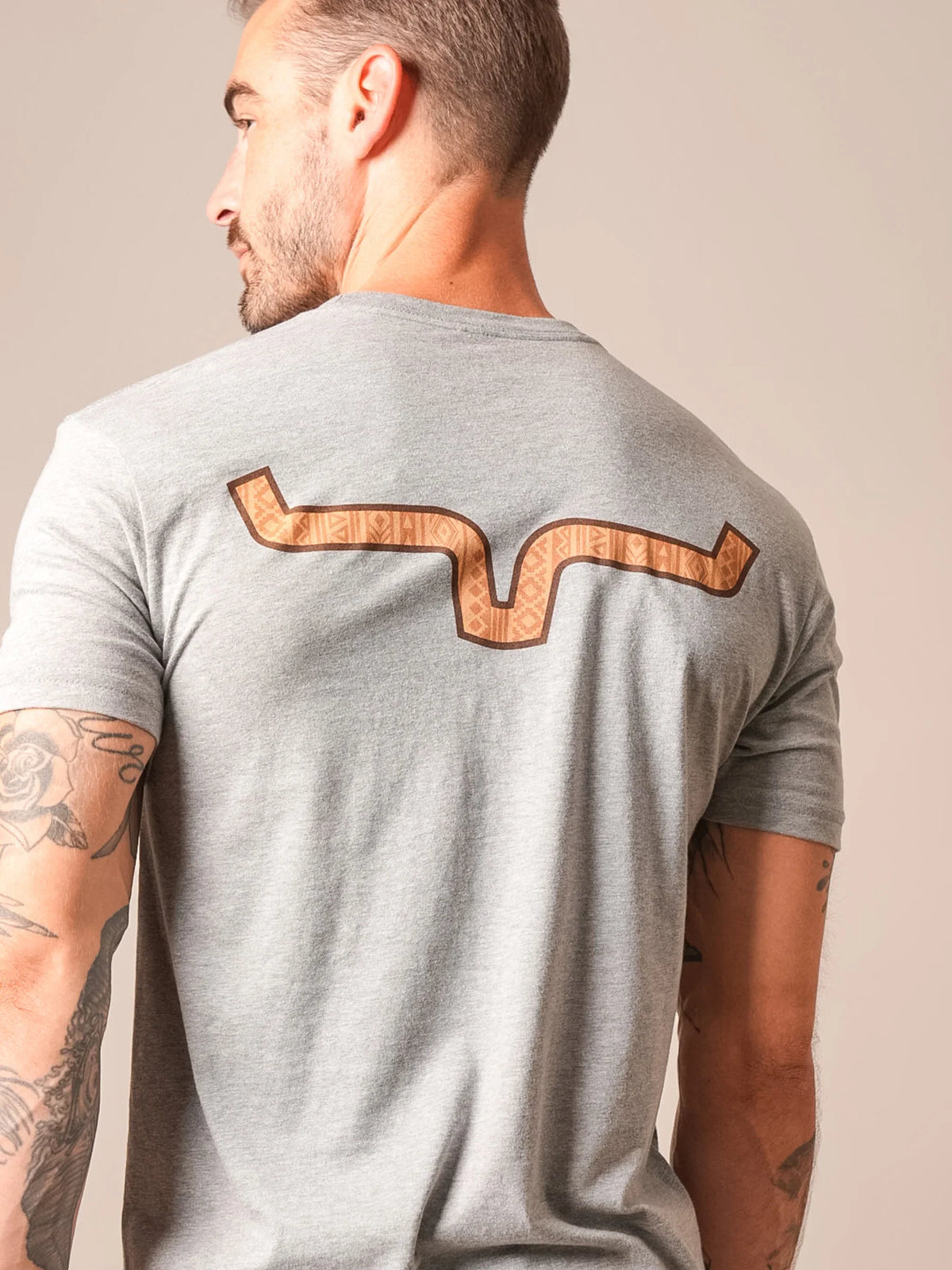 Kimes Ranch Delano shirt in Dark Grey Heather, back view, with a brown geometric snake graphic on the back