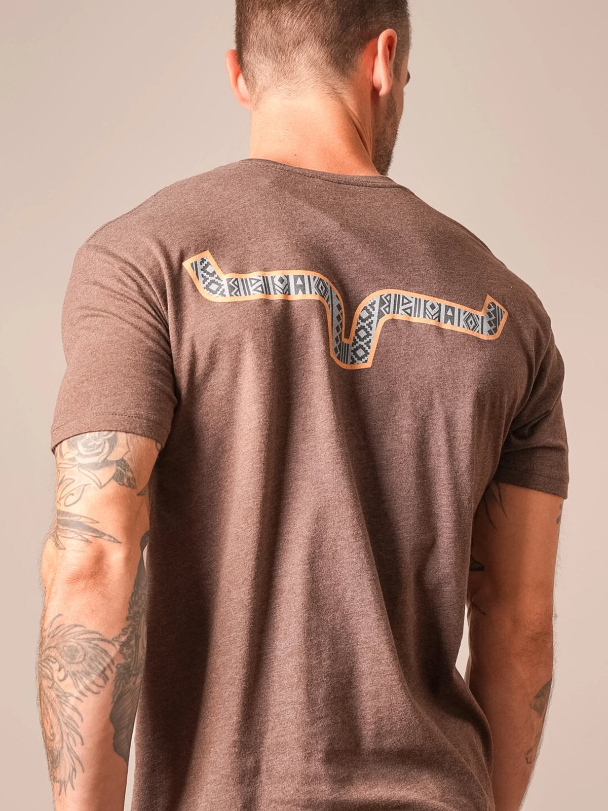 Kimes Ranch Delano shirt in Espresso, back view, with a back yoke graphic in tan and black tribal patterns