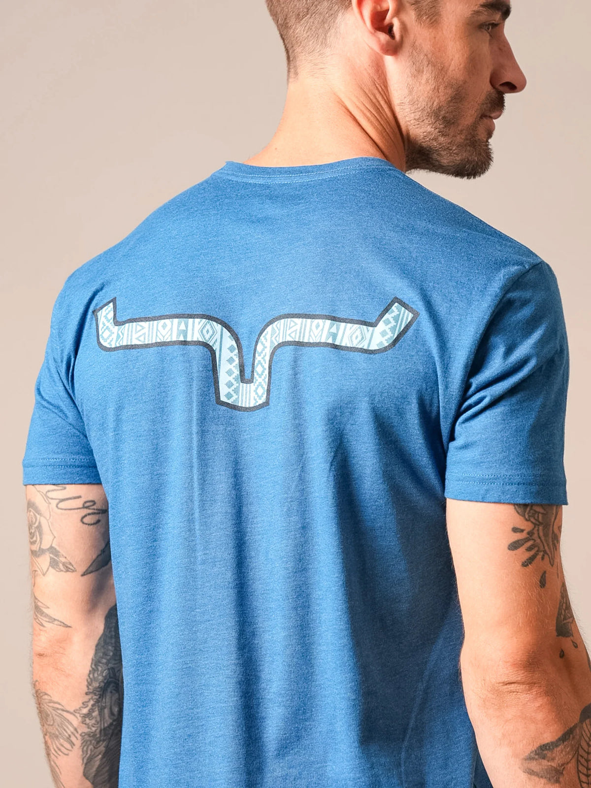 Kimes Ranch Delano shirt in Marine Blue, back view, with a stylized Kimes Ranch logo on the back
