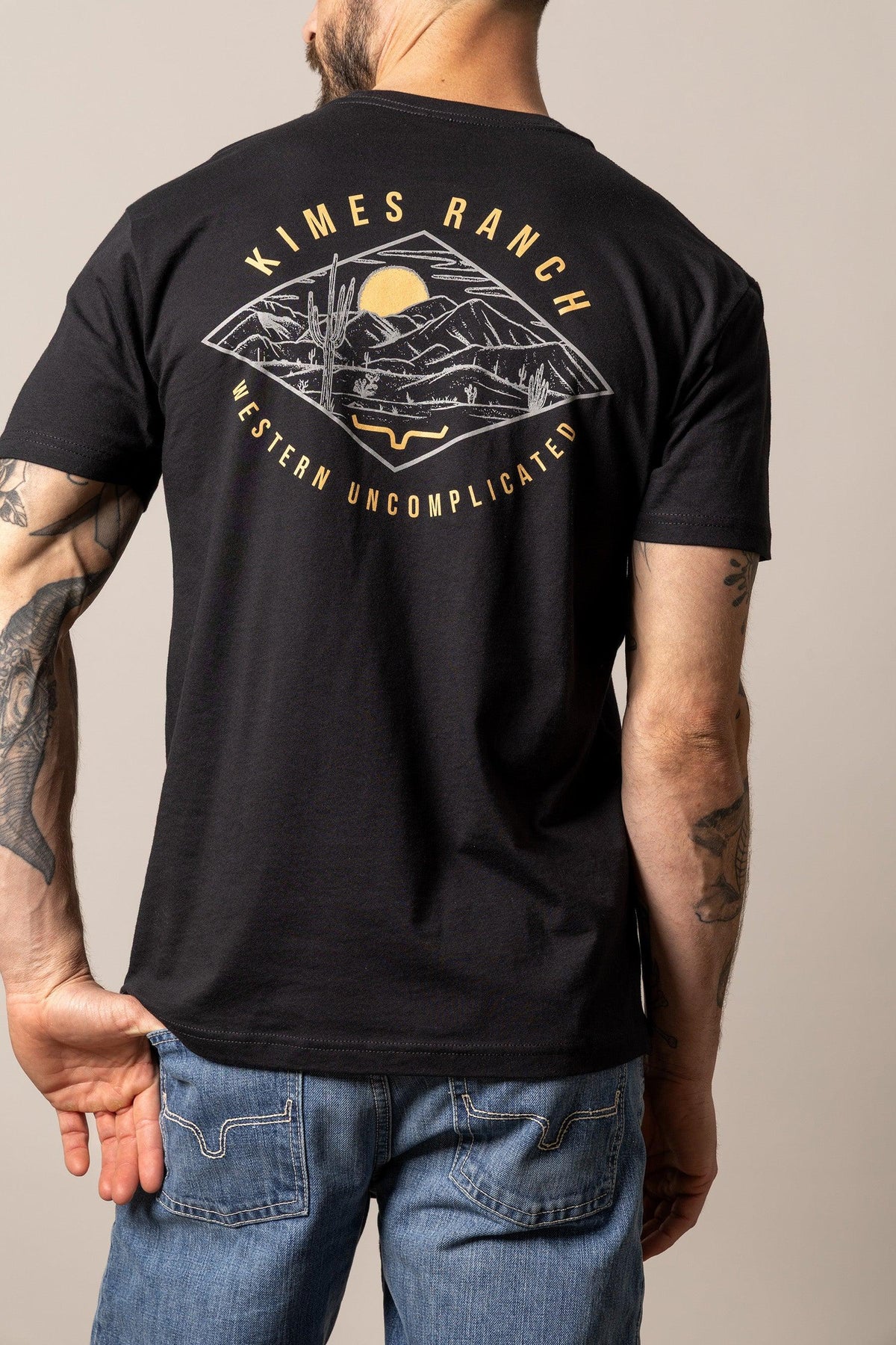 Kimes Ranch Desert Diamond shirt in Black, back view, with a back graphic of a desert landscape