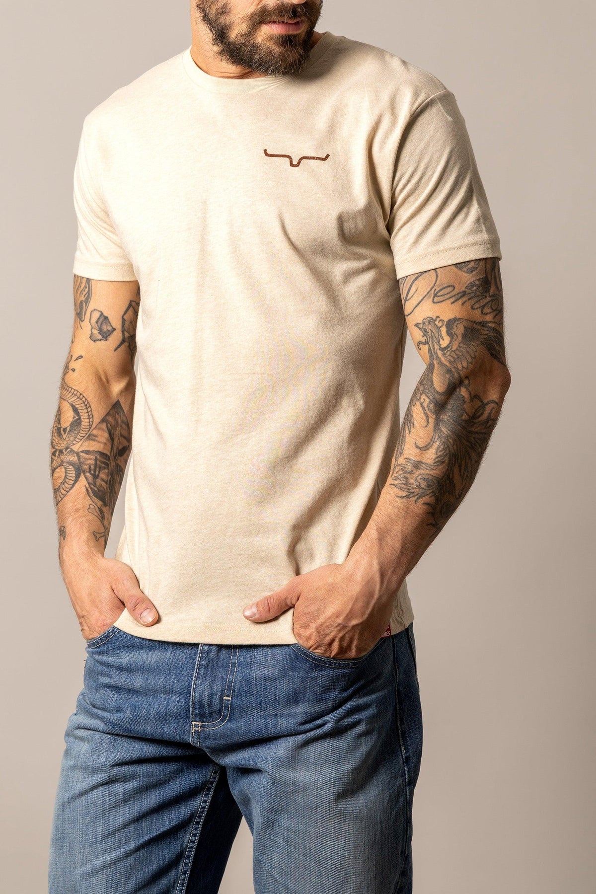 Kimes Ranch Desert Diamond Cream short sleeve shirt with a small embroidered logo on the chest