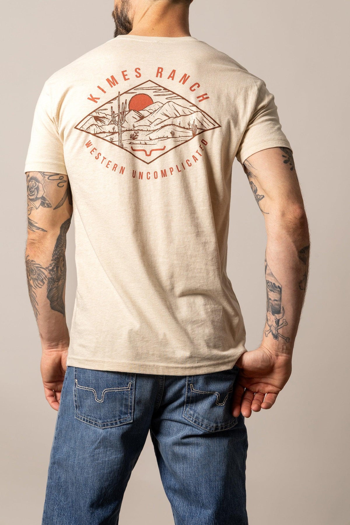Kimes Ranch Desert Diamond shirt in Cream, back view, with a back graphic of a diamond containing a desert landscape