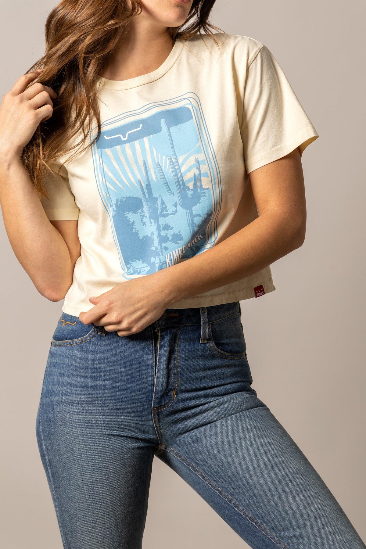 Kimes Ranch Desert Trip shirt in Ivory with a blue desert landscape graphic and cacti print