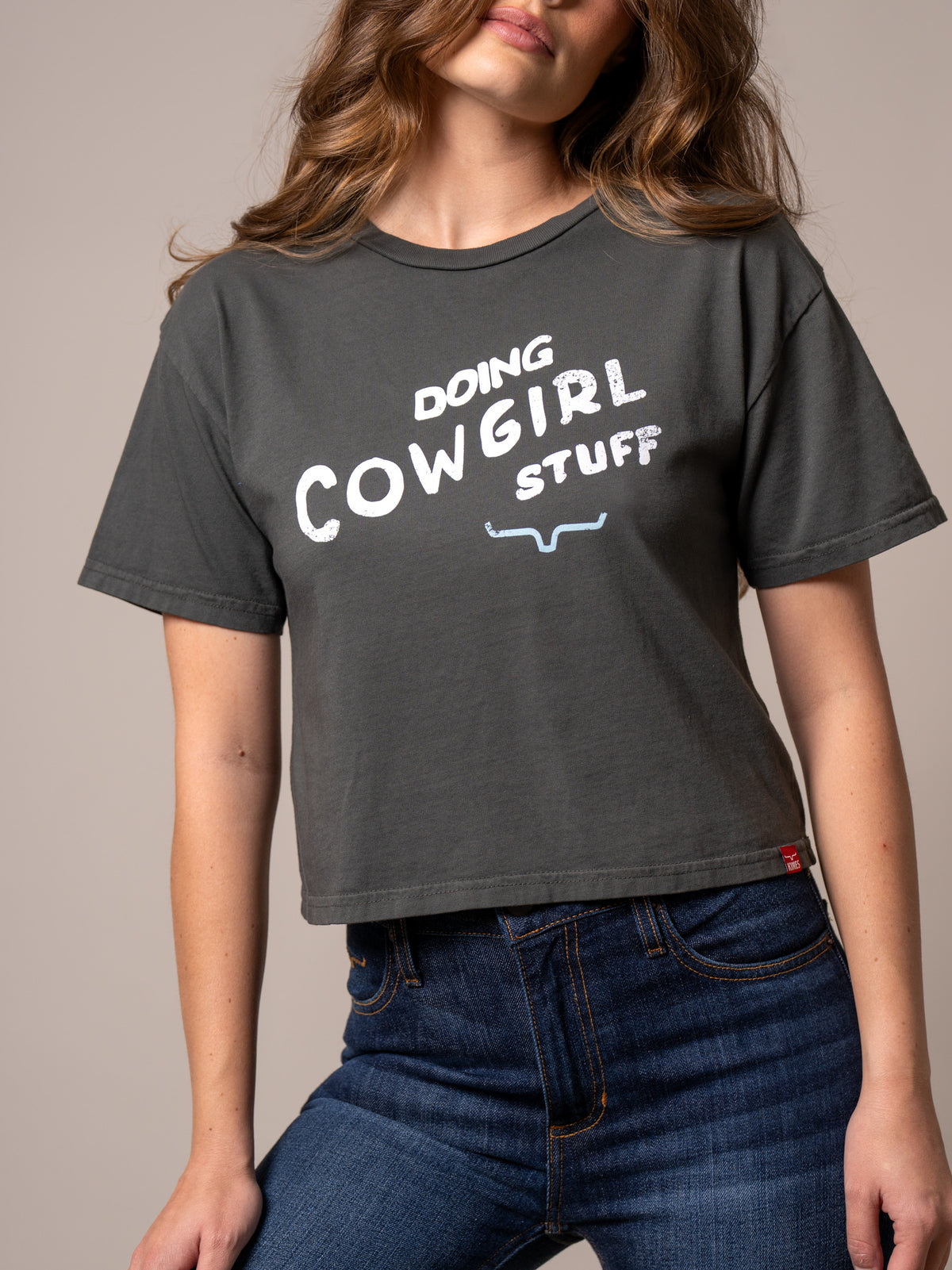 Kimes Ranch Doing Cowgirl Stuff shirt in Pepper with white graphic text and blue horns