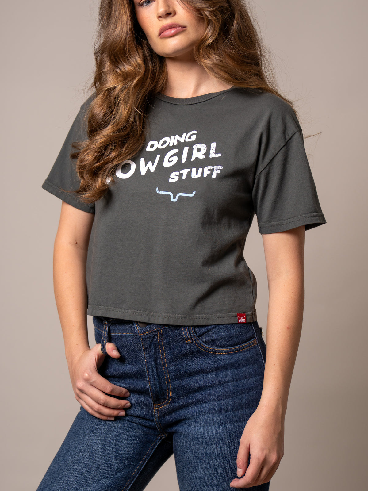 Kimes Ranch Doing Cowgirl Stuff shirt in Pepper with white graphic text and longhorn logo