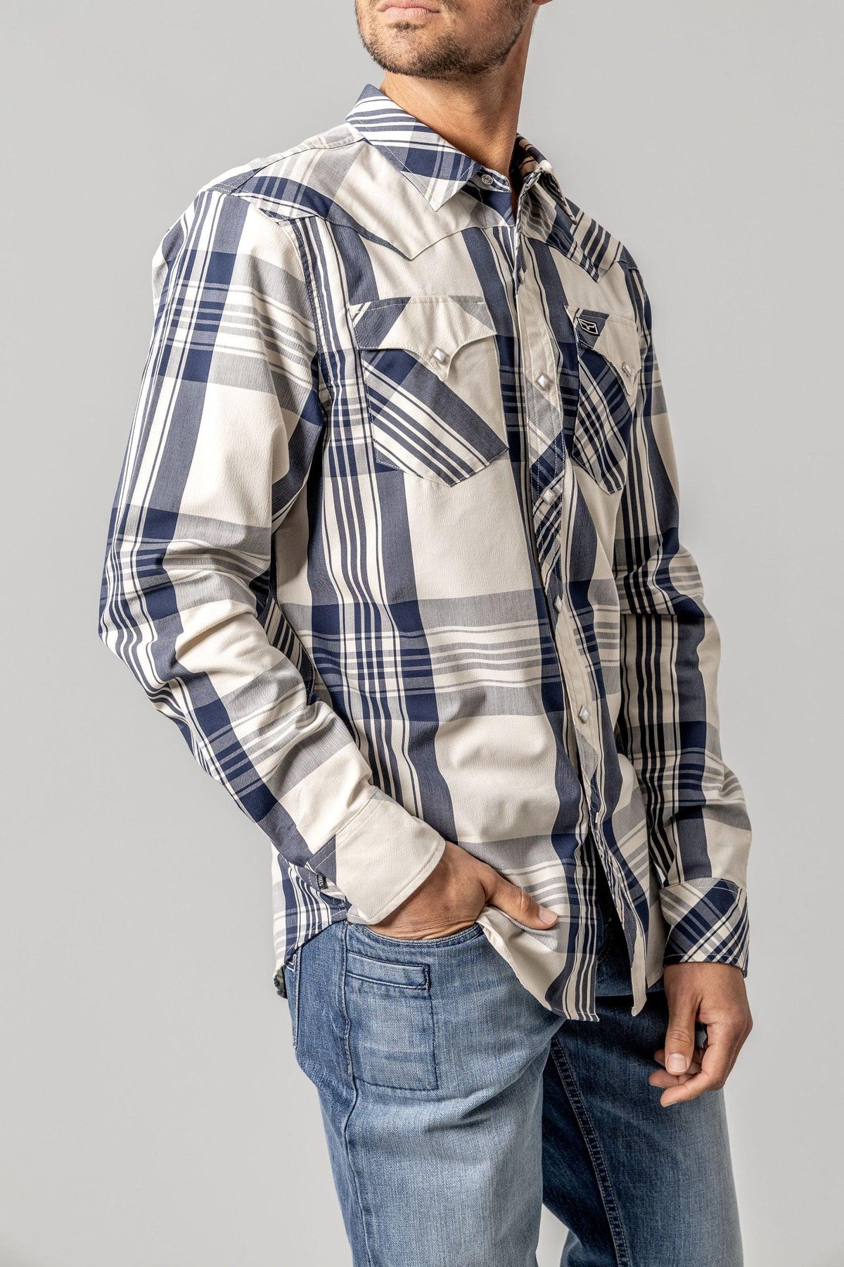 Kimes Ranch Double R dress shirt in Navy, side view, with a plaid pattern and two chest pockets