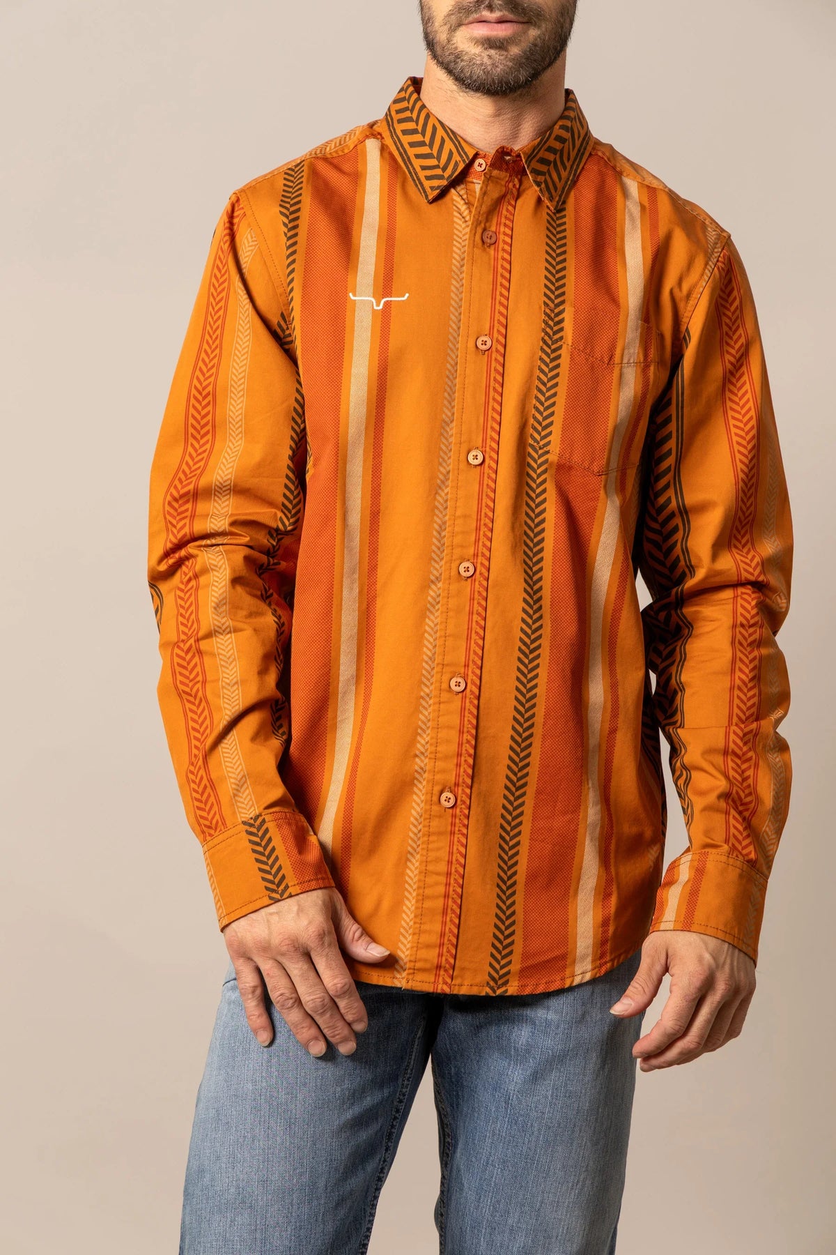 Kimes Ranch Double Tap dress shirt in Burnt Orange with vertical stripes and a white logo on the chest