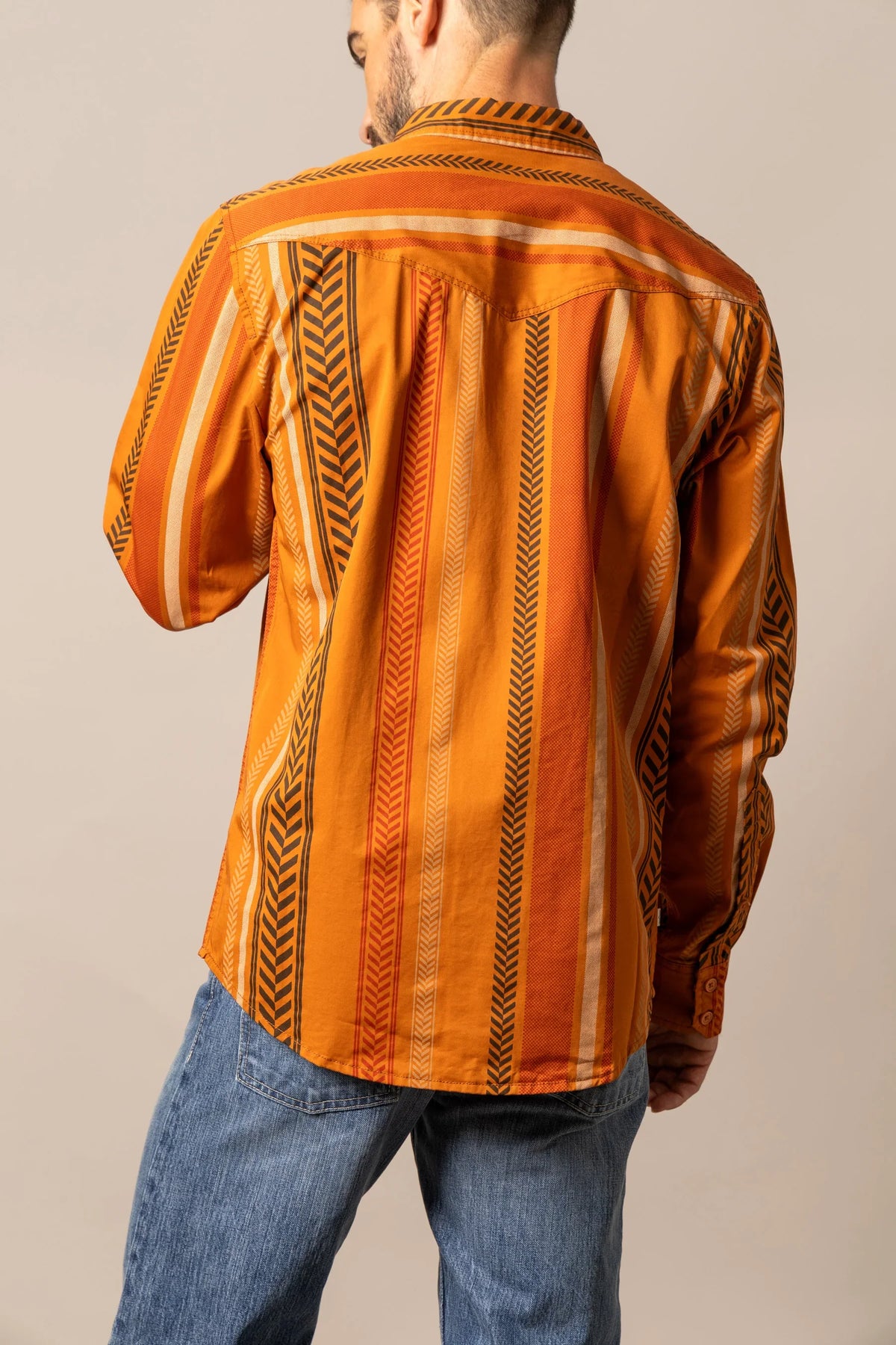 Kimes Ranch Double Tap dress shirt in Burnt Orange, back view, with vertical tribal stripes and a back yoke