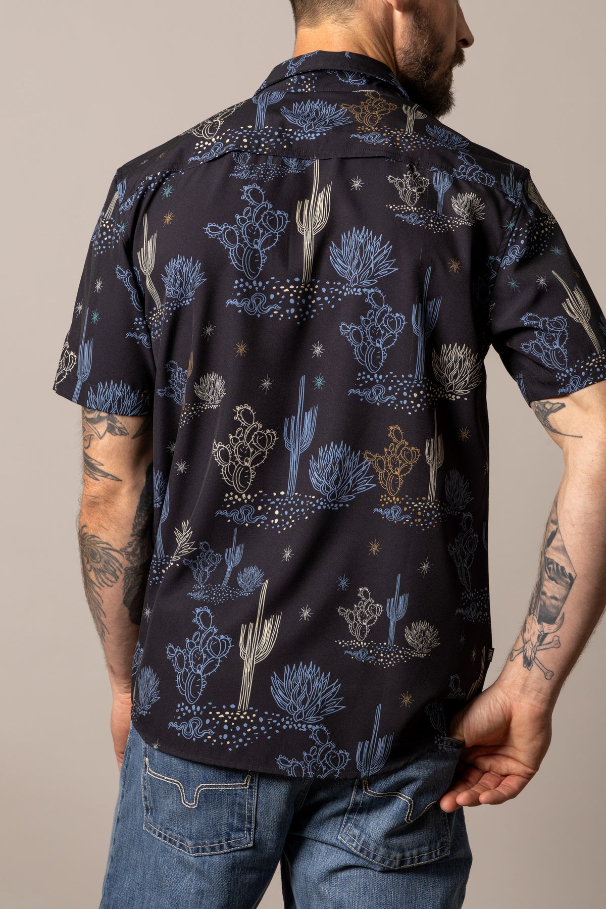 Kimes Ranch Dunn dress shirt in Black, back view, with a desert print of cacti and stars