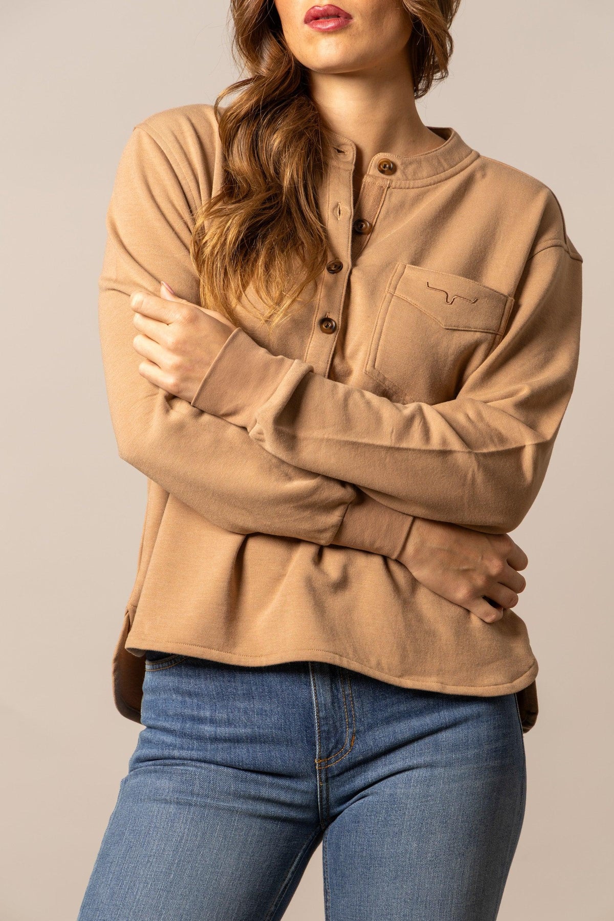 Kimes Ranch Elouise Henley sweater in Brown with a button placket and chest pocket featuring the Kimes Ranch logo