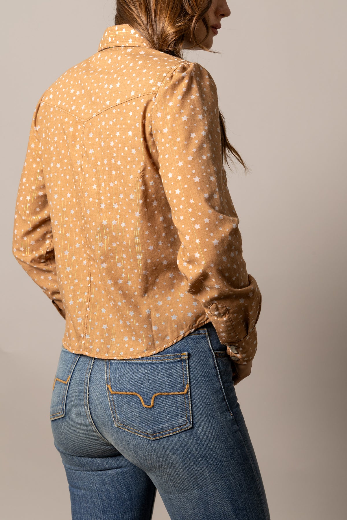 Kimes Ranch Etoile top in Tobacco, back view, with a white star print and long sleeves