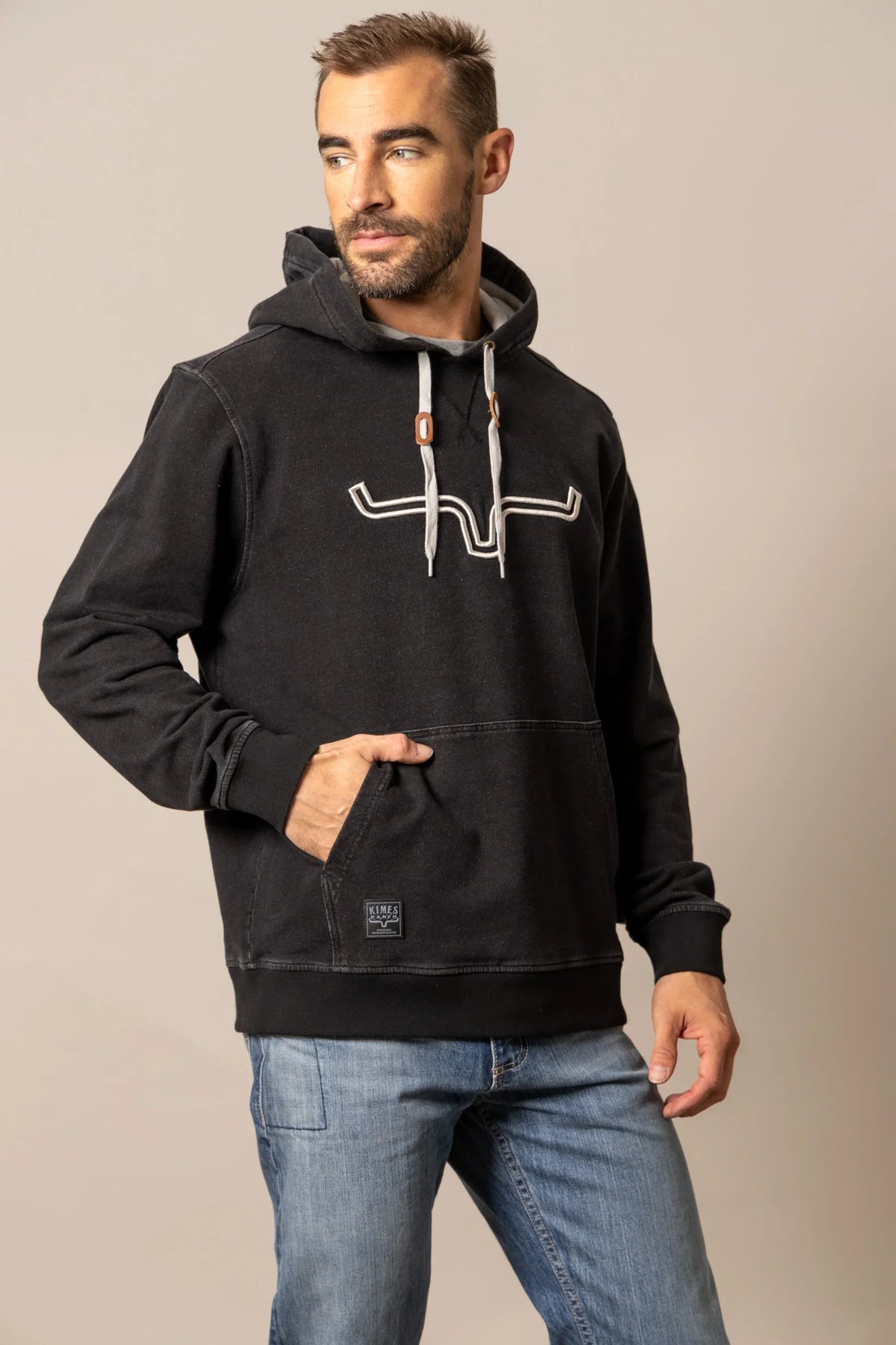 Kimes Ranch FTI Hoodie in Faded Black with a white logo on the chest and a front kangaroo pocket