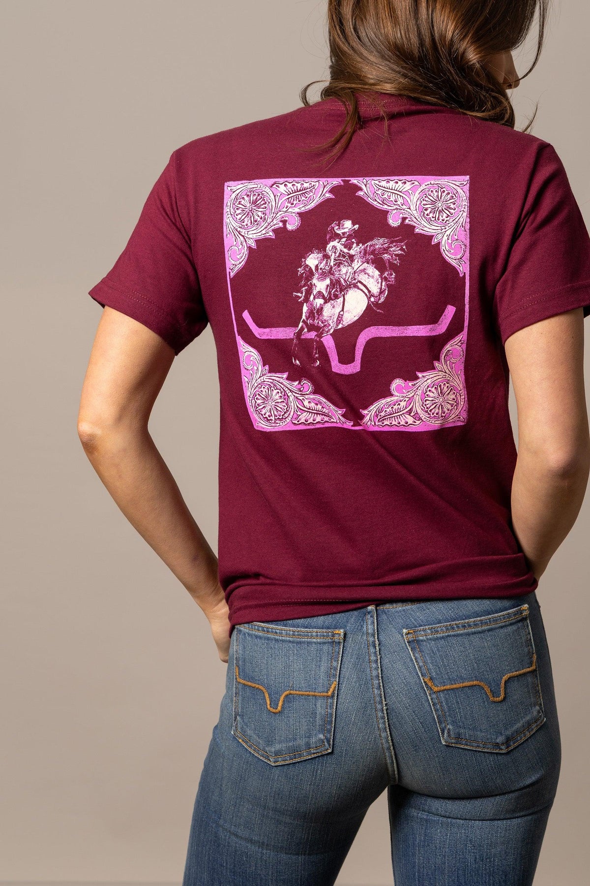 Kimes Ranch Fallon Bandana shirt in Burgundy, back view, with a pink bandana print featuring a rodeo scene and ornate corners