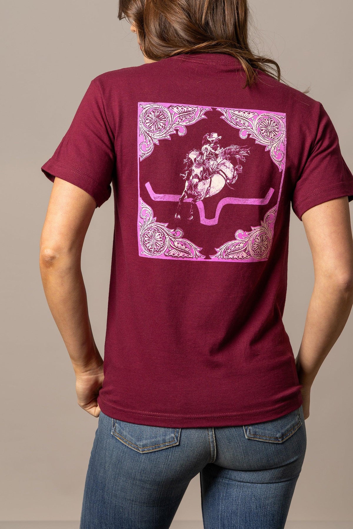 Kimes Ranch Fallon Bandana shirt in Burgundy, back view, with a pink bandana print of a cowboy on a bucking horse