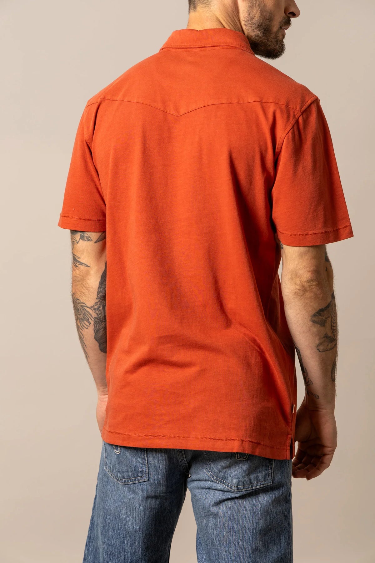 Kimes Ranch Fluger Polo in Brick Red, back view, with a back yoke and short sleeves
