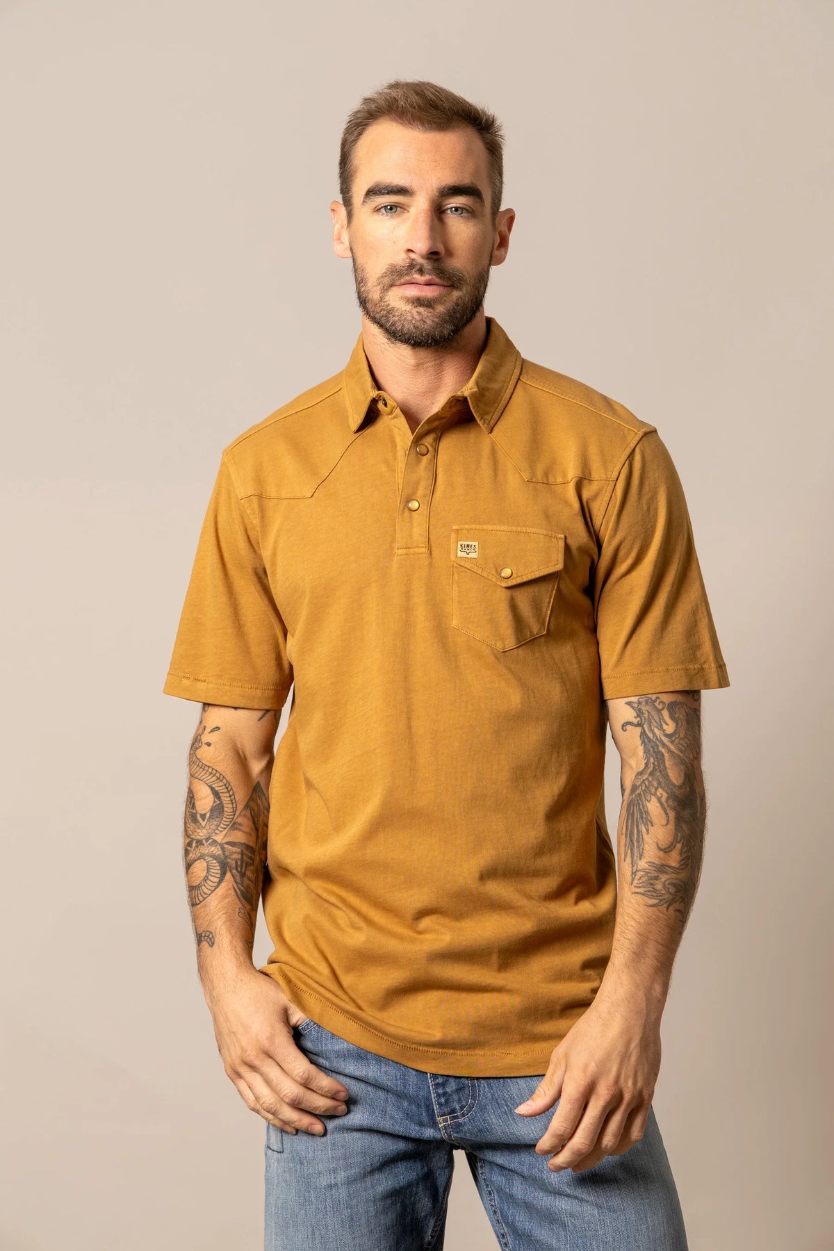 Kimes Ranch Fluger Polo in Work Wear Brown with a button placket and chest pocket