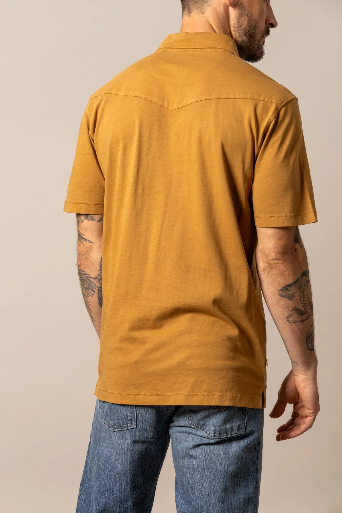 Kimes Ranch Fluger Polo in Work Wear Brown, back view, with a back yoke and short sleeves