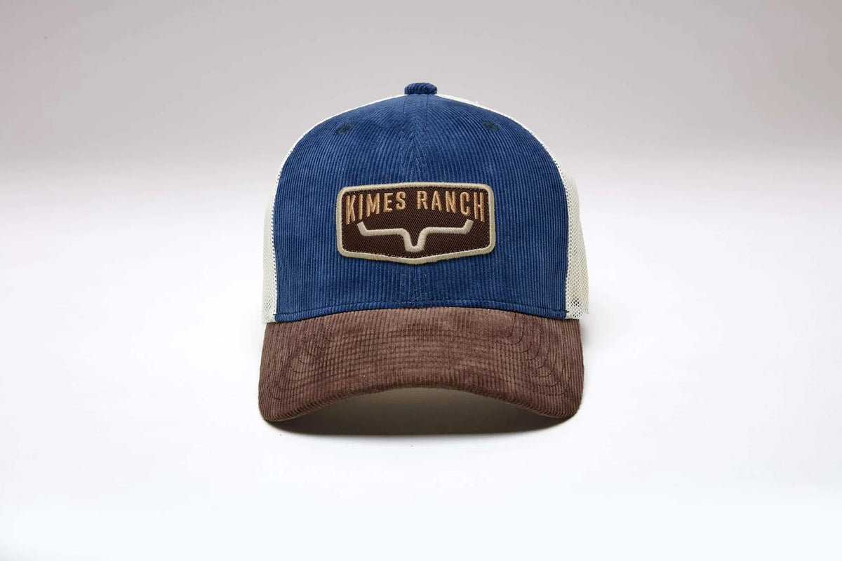 Kimes Ranch Fourteen trucker hat in Blue with a brown brim and embroidered Kimes Ranch logo patch