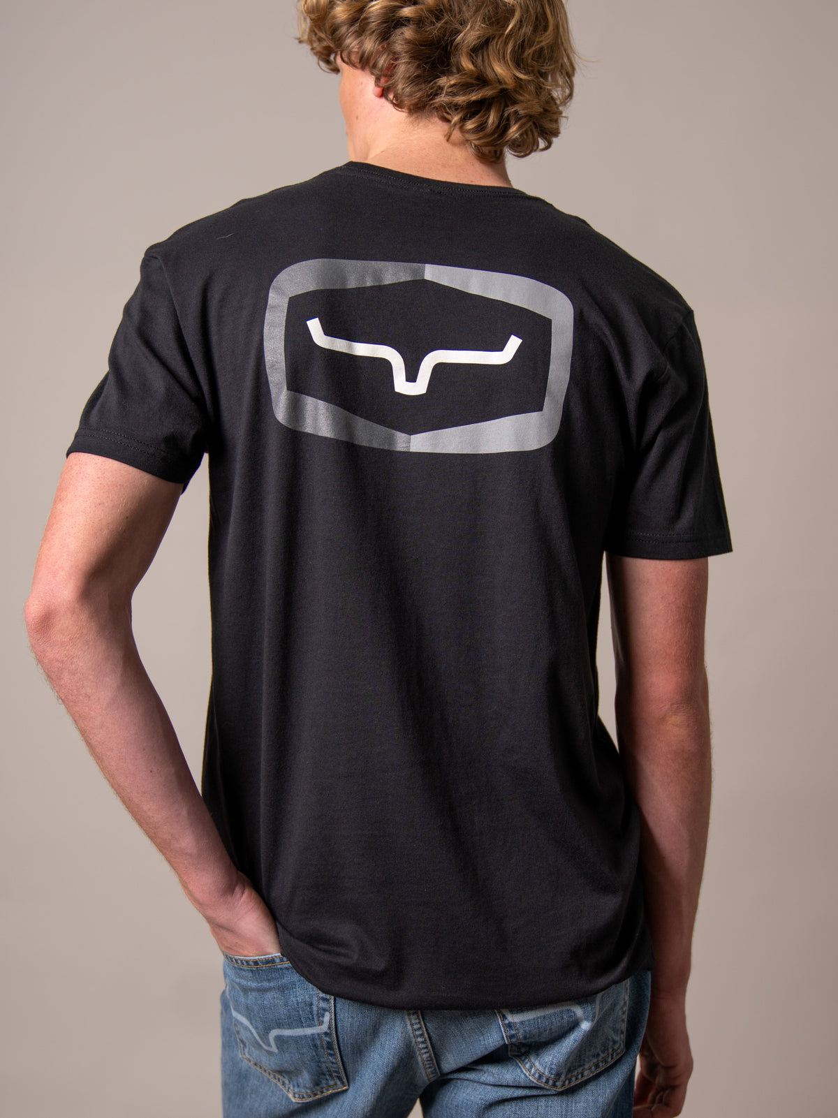 Kimes Ranch Framework shirt in Black, back view, with a large back graphic featuring the Kimes Ranch logo