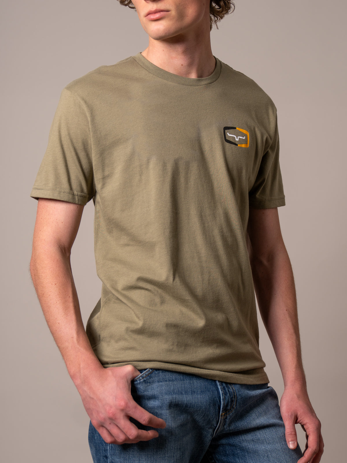 Kimes Ranch Framework shirt in Light Olive with a chest pocket featuring the Kimes Ranch logo