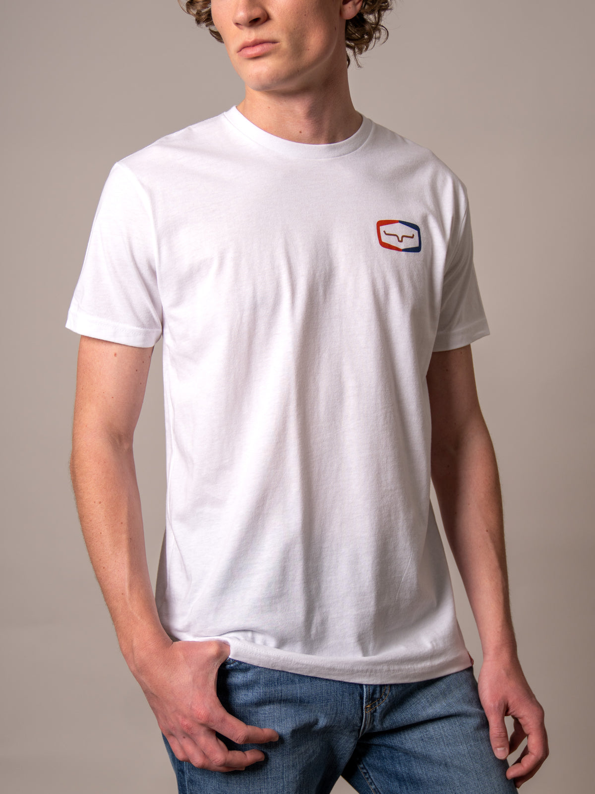Kimes Ranch Framework White short sleeve t-shirt with a red and blue logo on the chest