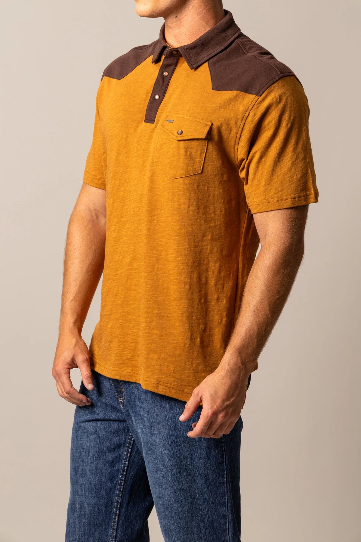 Kimes Ranch G-2 Polo in Work Wear Brown, side view, with mustard body and contrasting brown yoke and collar