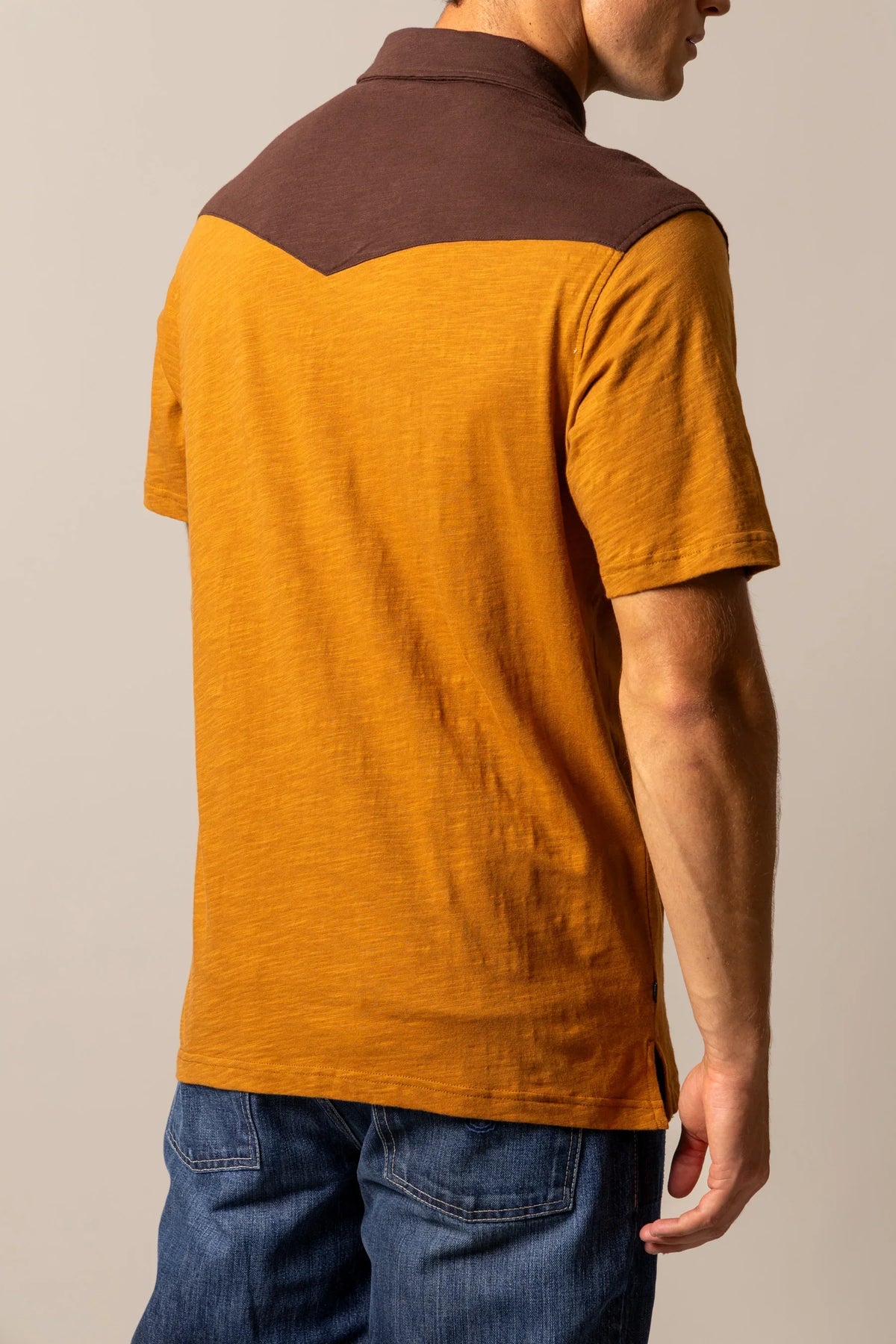 Kimes Ranch G-2 Polo in Work Wear Brown, back view, with a brown yoke and short sleeves