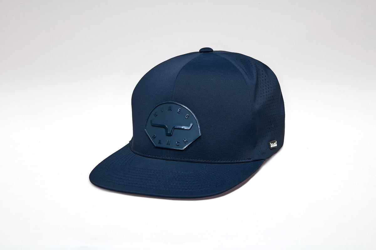 Kimes Ranch Gilette hat in Navy, side view, with a tonal logo patch on the front and perforated side panels