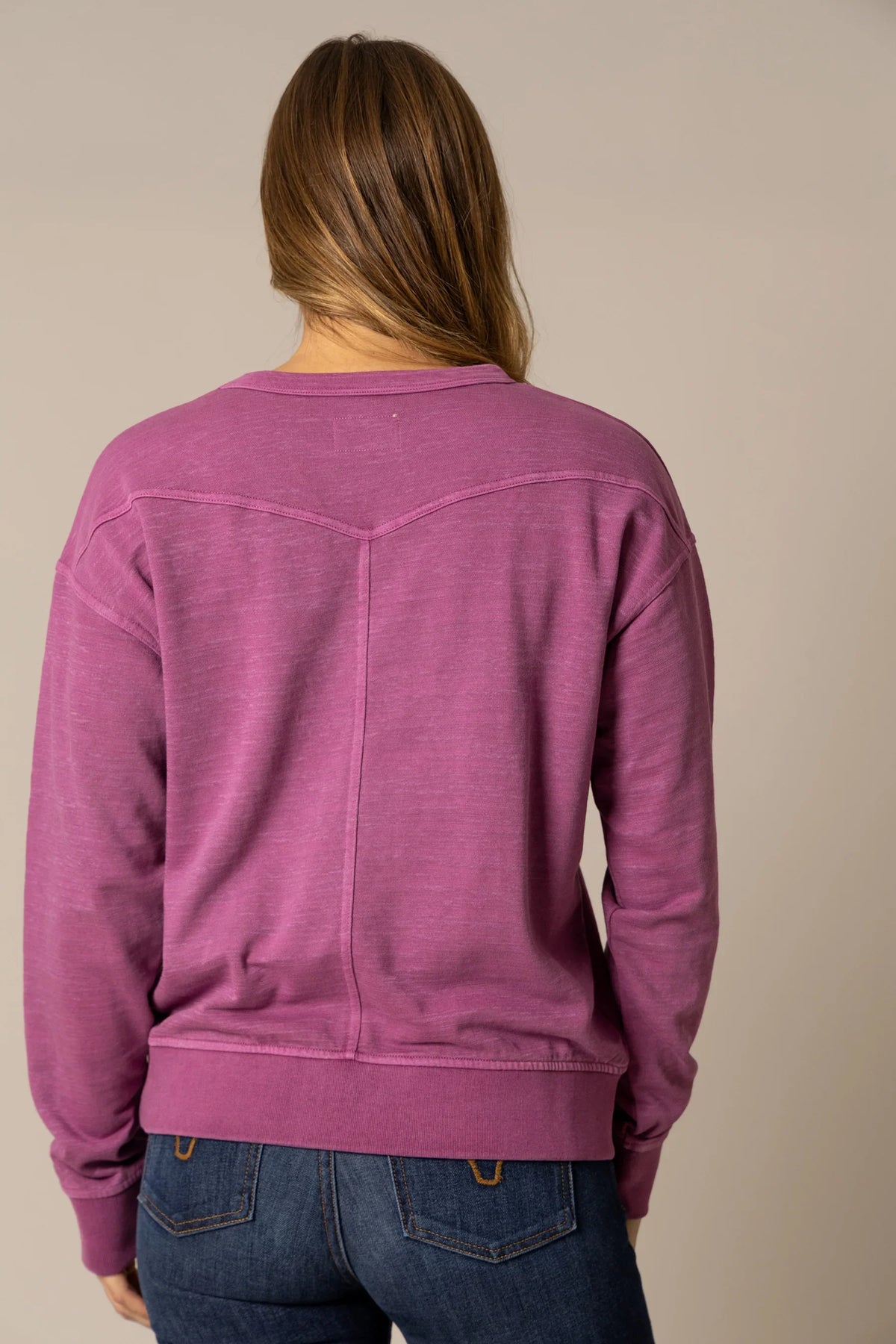 Kimes Ranch Gina Western Crew sweatshirt in Magenta, back view, with a yoke and center seam