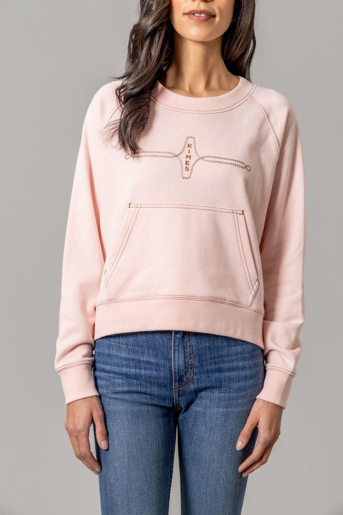 Kimes Ranch Gracie Cropped Crewneck sweatshirt in Pink with a front kangaroo pocket and embroidered logo