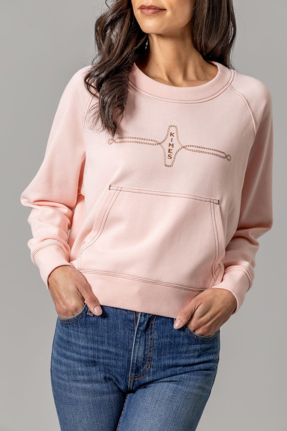 Kimes Ranch Gracie Cropped Crewneck sweatshirt in Pink with a front kangaroo pocket and embroidered Kimes Ranch logo