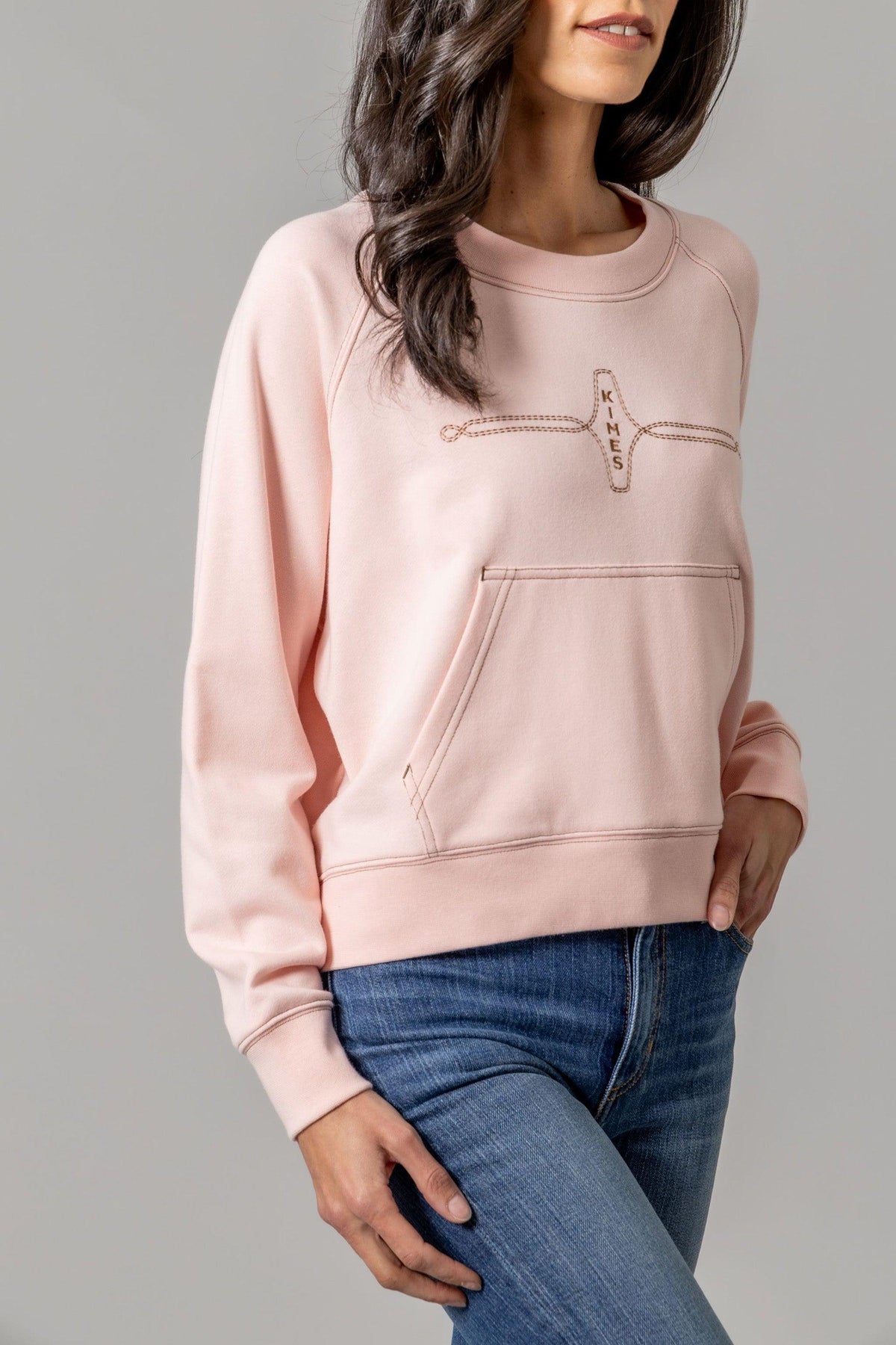 Kimes Ranch Gracie Cropped Crewneck sweatshirt in Pink with a front kangaroo pocket and embroidered Kimes Ranch logo