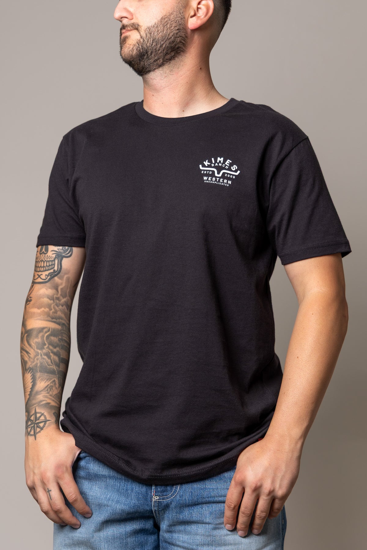 Kimes Ranch Grandview Black short sleeve shirt with a chest logo reading Western Uncomplicated