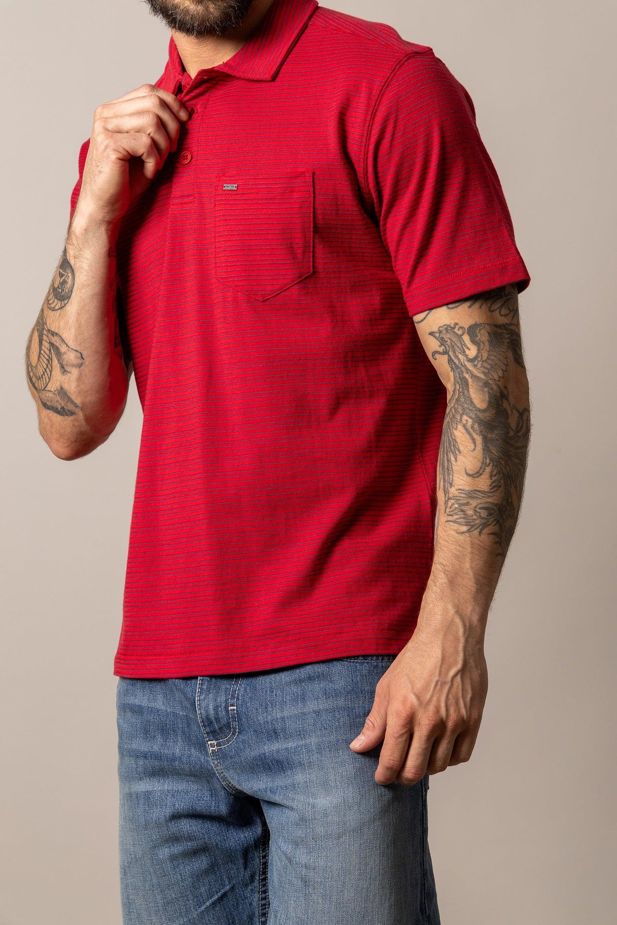 Kimes Ranch Harlan Polo in Red with a chest pocket and subtle horizontal stripes