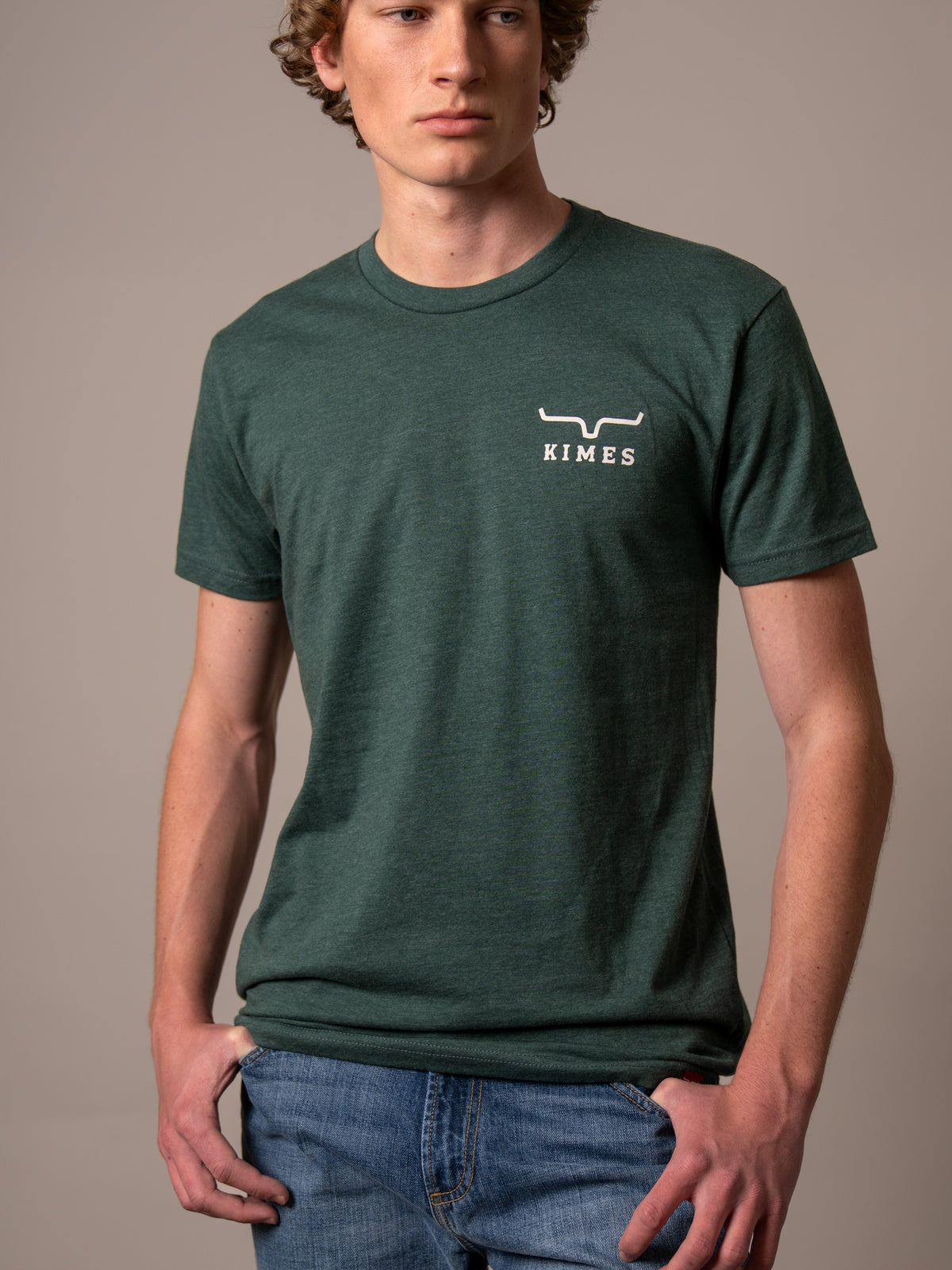 Kimes Ranch Heavy Text short sleeve shirt in Heather Forest Green with a chest logo