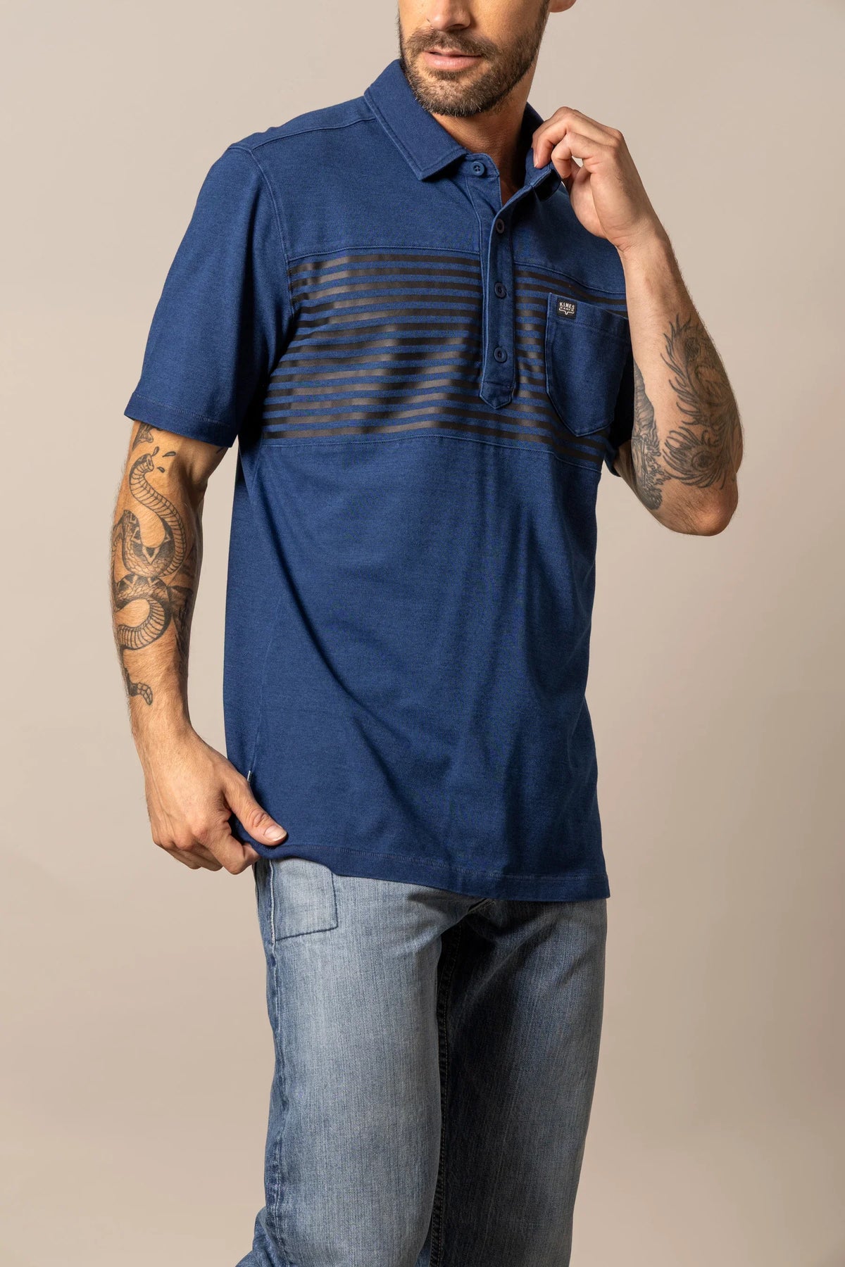 Kimes Ranch Holbrook Polo in Indigo with horizontal stripes across the chest and a chest pocket