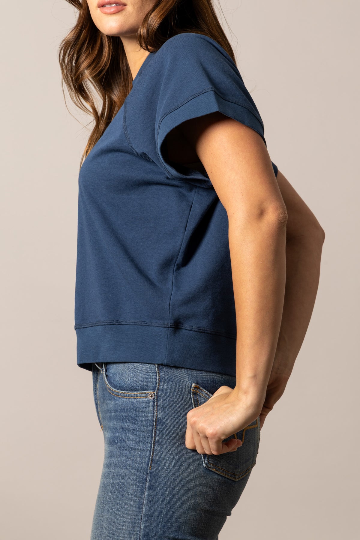 Kimes Ranch Holly sweatshirt in Dark Blue, side view, with short sleeves and a ribbed hem