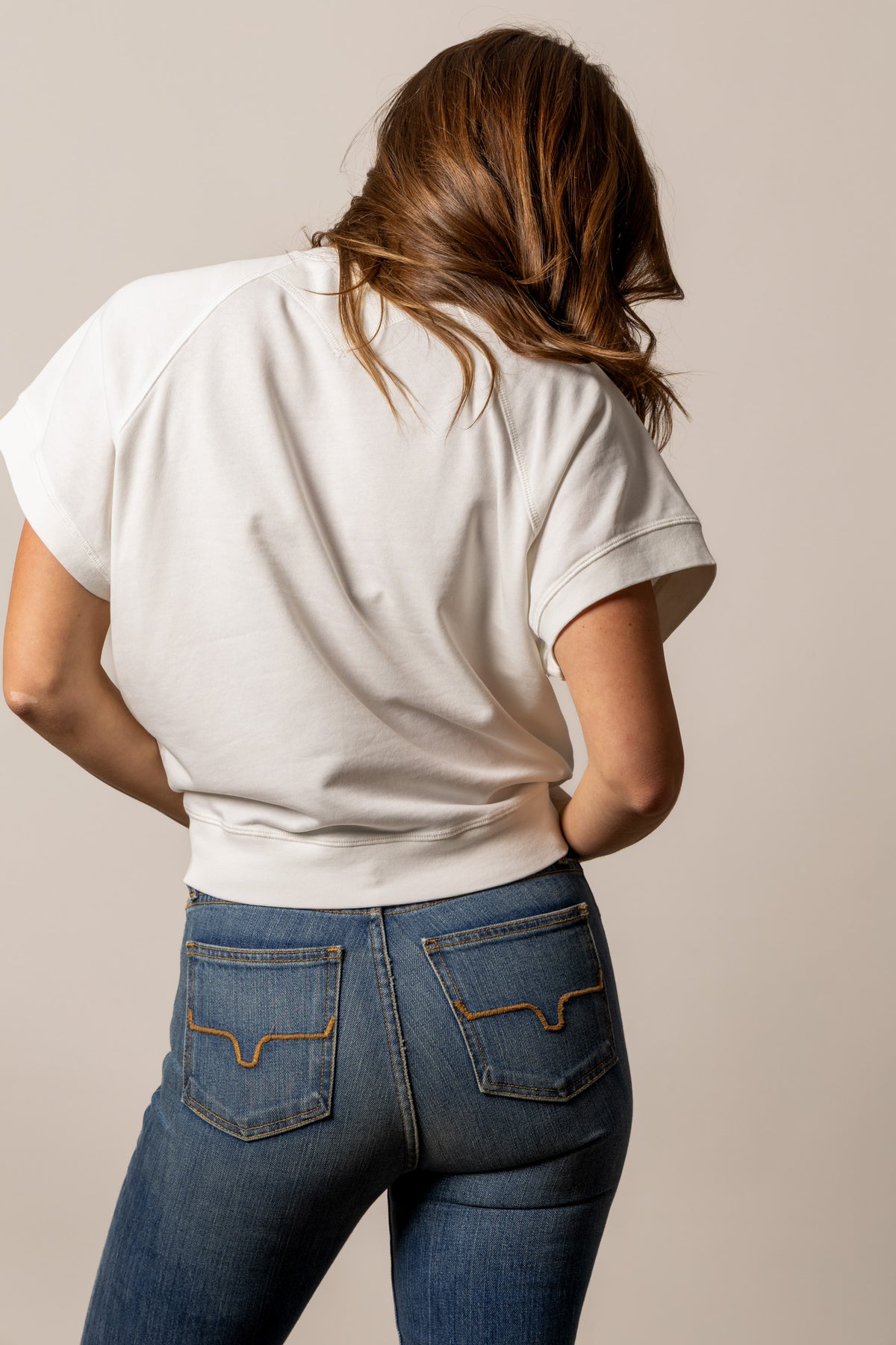 Kimes Ranch Holly sweatshirt in Pristine, back view, with raglan sleeves and a ribbed hem