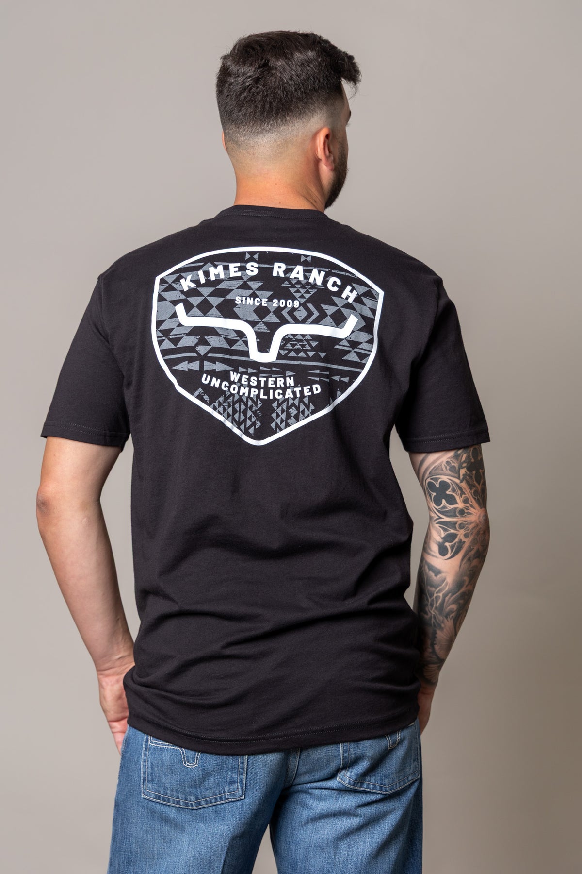 Kimes Ranch Honor shirt in Black, back view, with a large back graphic featuring the Kimes Ranch logo