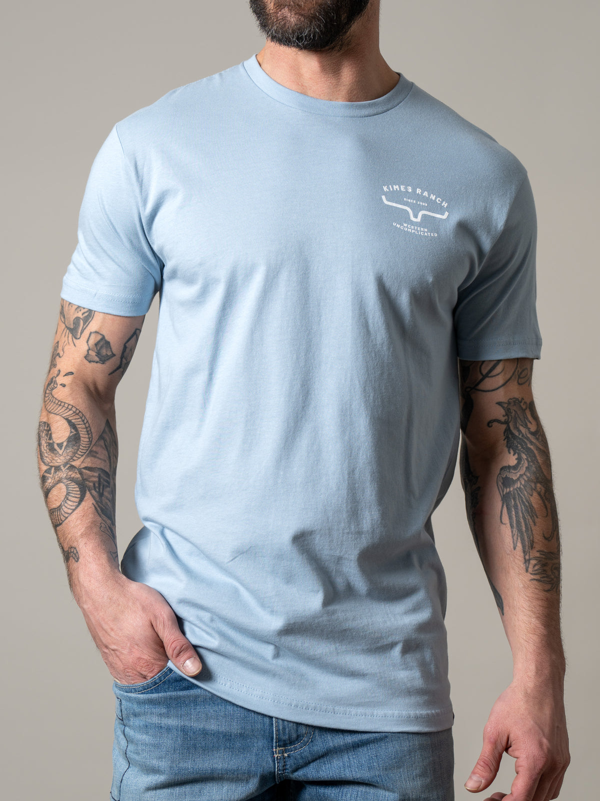 Kimes Ranch Honor shirt in Stonewash with a chest logo and short sleeves