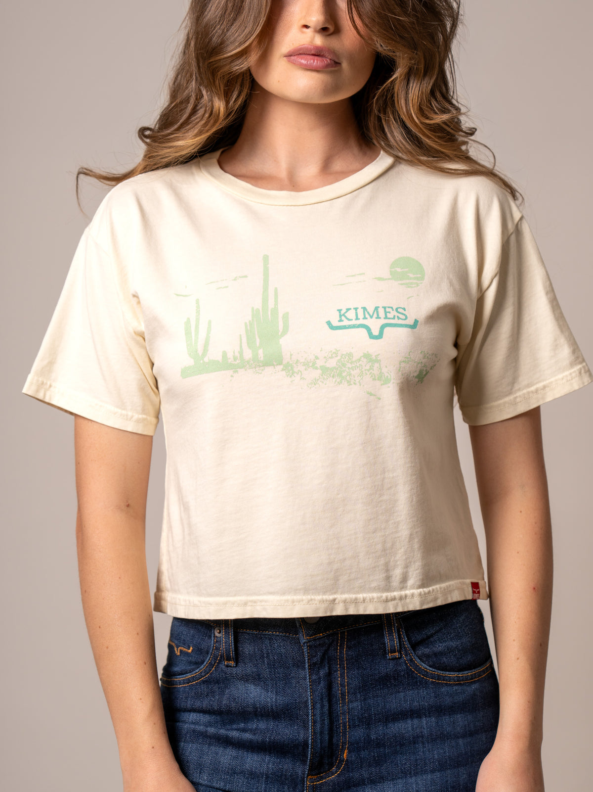 Kimes Ranch Horizon West shirt in Ivory with a green cactus landscape graphic and Kimes Ranch logo